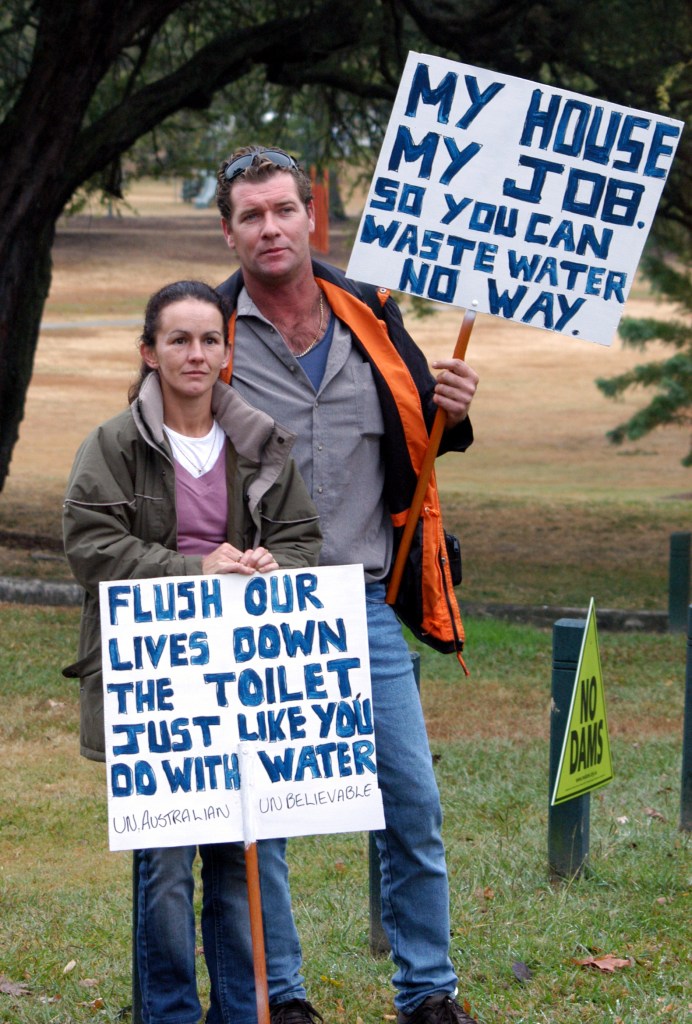 Marita and Clinton Wood turned up to the rally in Brisbane. The Woods will loose their house and jobs because of the Traveston Dam - Traveston Dam protest - June 2006 - Gympie Times collection