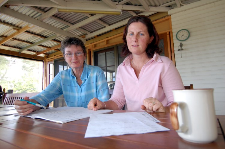 June Blighton and Melanie Larson organise buses for the Rally in Brisbane against the Dam Traveston Dam protest - June 2006 - Gympie Times collection