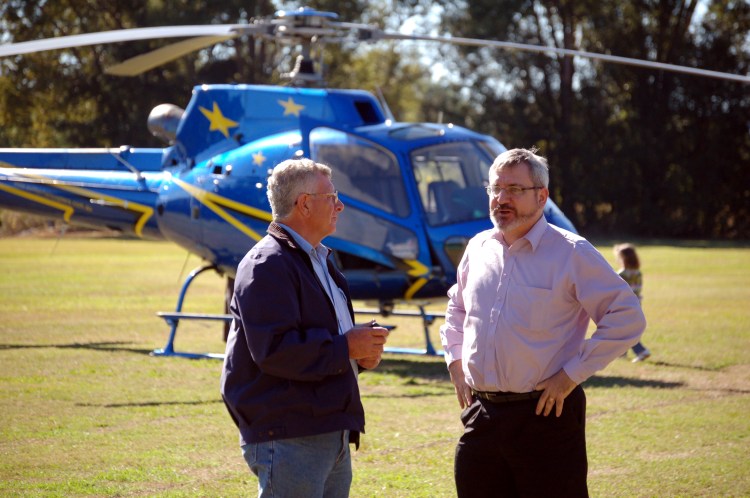 Rick Elliot greets Senator Andrew Bartlett (Democrats 1997-2008) after he choppered into Kandanga to lend his support to the anti dam cause - Gympie Times collection